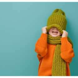 L'image représente un enfant avec un bonnet et une écharpe, prêt à affronter le froid de l'hiver. Comment passer l'hiver tranquille grâce à phytorub
